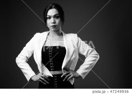 Young beautiful Asian transgender businesswoman in black and whi Young beautiful Asian transgender businesswoman in black and whi 47249936