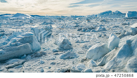 Global Warming and Climate Change - Icebergs from melting glacier on Greenland 47250868