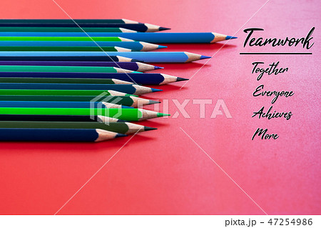 Teamwork concept. group of color pencil on red Teamwork concept. group of color pencil on red 47254986