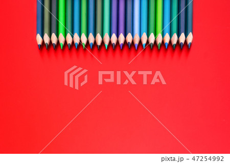 Diversity concept. row of mix color pencil on red Diversity concept. row of mix color pencil on red 47254992