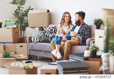 happy young married couple moves to new apartment happy young married couple moves to new apartment 47264717