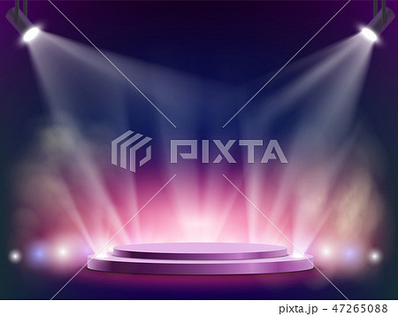 Spotlights illuminates a round stage. 47265088