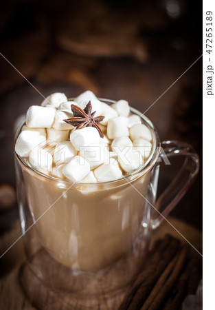 Hot coffee with milk in transparent glass  47265189