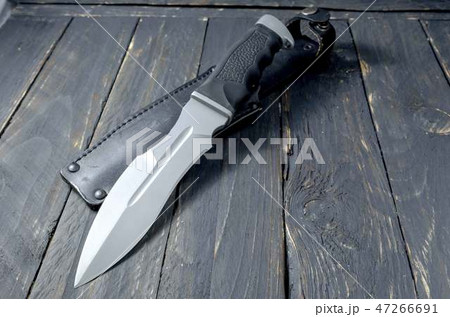 Military knife on black background. Large knife. Military knife on black background. Large knife. 47266691