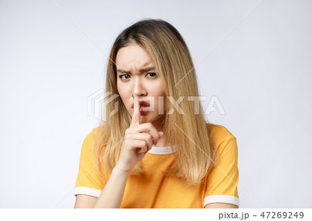 Portrait of sad crying pensive mad crazy asian woman. Closeup young asian woman isolated on white Portrait of sad crying pensive mad crazy asian woman. Closeup young asian woman isolated on white 47269249