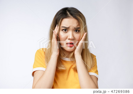 Portrait of sad crying pensive mad crazy asian woman. Closeup young asian woman isolated on white Portrait of sad crying pensive mad crazy asian woman. Closeup young asian woman isolated on white 47269386