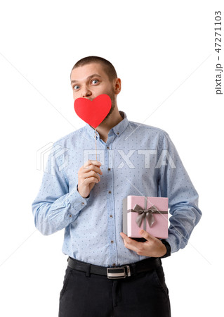 Young happy man holding red paper heart. Young happy man holding red paper heart. 47271103