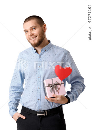 Young happy man holding red paper heart. 47271104