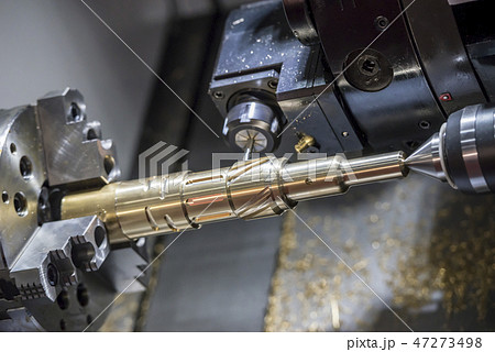 The CNC lathe machine cutting the slot groove . The CNC lathe machine cutting the slot groove . 47273498