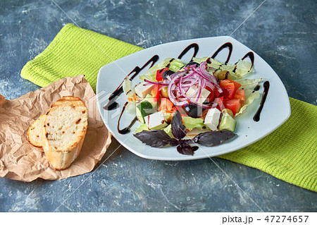 Greek salad with fresh vegetables, feta cheese and black olives 47274657