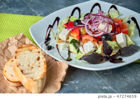Greek salad with fresh vegetables, feta cheese and black olives 47274659