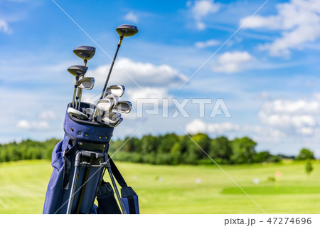 Golf equipment bag standing on a course. 47274696