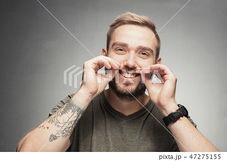 Young man making funny silly face Young man making funny silly face 47275155
