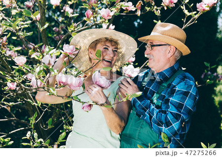 Senior marriage standing next to a tree Senior marriage standing next to a tree 47275266