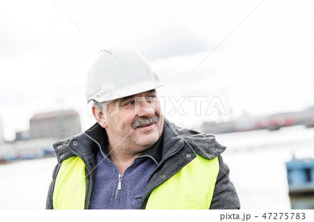 Senior engineer builder at the construction site. 47275783
