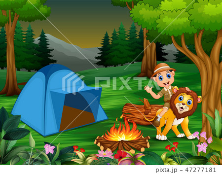 Zookeeper boy and a lion next to the tent 47277181
