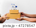 Hand of delivery man send two boxes of parcel 47278547