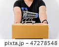 hand of woman delivery a parcel with mini trolley  47278548