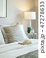 Glasses and book on bed in modern interior bedroom 47278633