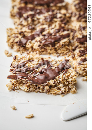 Homemade chocolate oat bars on a white  47280543