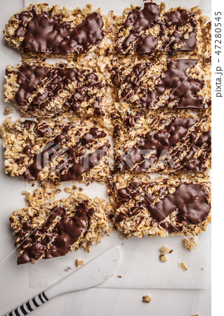 Homemade chocolate oat bars on a white Homemade chocolate oat bars on a white 47280545