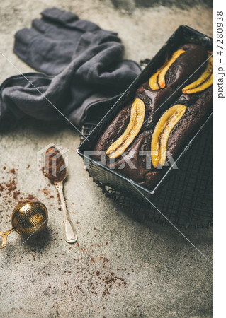 Chocolate banana cake with cinnamon in baking tin 47280938