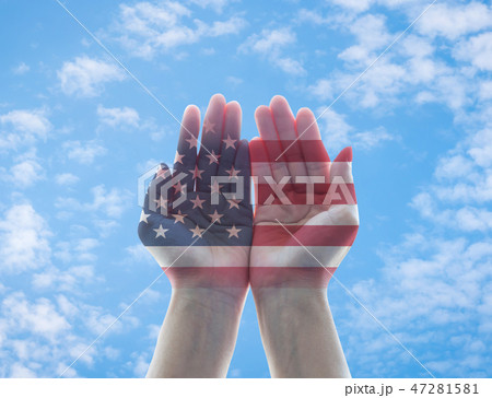 America flag pattern on woman hands with open palm America flag pattern on woman hands with open palm 47281581