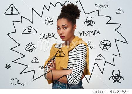 Young woman studio isolated in white crossed arms looking camera 47282925
