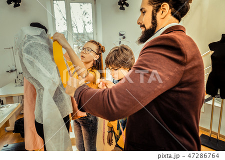 Creative talented family feeling amazing designing clothes together 47286764