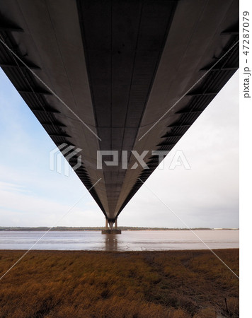 Looking out from underneath the road deck of the Humber Bridge single span suspension bridge Looking out from underneath the road deck of the Humber Bridge single span suspension bridge 47287079