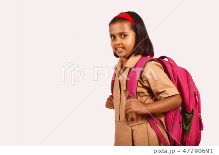 Little girl in school uniform and bag posing Pune Little girl in school uniform and bag posing Pune 47290691