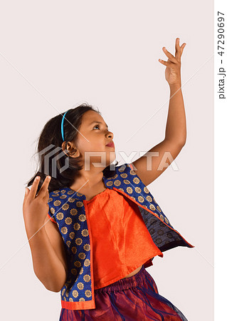 Little girl dancing in front of camera Pune 47290697