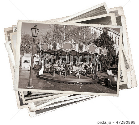 Old carousel with horses Stack of old photos 47290999