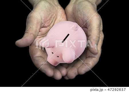 Old hands with piggy bank, pension concept Old hands with piggy bank, pension concept 47292637