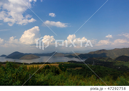Nature scene of Srinagarind Dam with cloudy sky  47292758