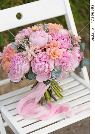 wedding bouquet of pink peonies tied with ribbons wedding bouquet of pink peonies tied with ribbons 47296098
