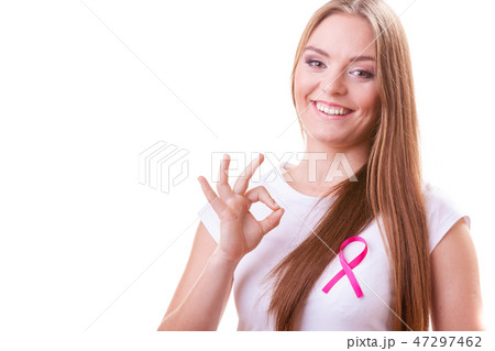 woman pink cancer ribbon on chest making ok sign 47297462