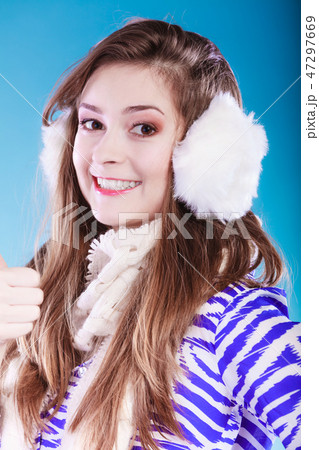 Young woman in wintertime. 47297669