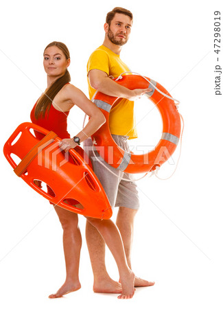 Lifeguards with rescue and ring buoy lifebuoy. Lifeguards with rescue and ring buoy lifebuoy. 47298019