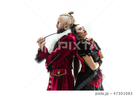 The young man wearing a traditional medieval costume of marquis and woman as marquise 47301083