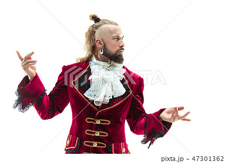 The young man wearing a traditional medieval costume of marquis 47301362