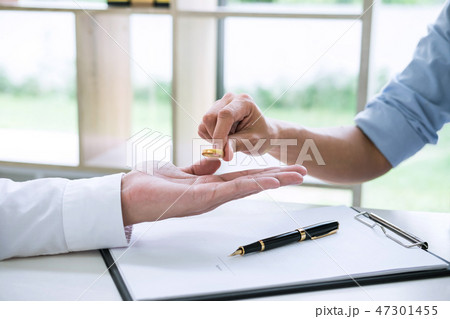 Husband and wife are signing decree of divorce (dissolution or c 47301455