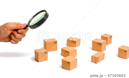 Magnifying glass is looking at the Cardboard boxes Magnifying glass is looking at the Cardboard boxes 47303603