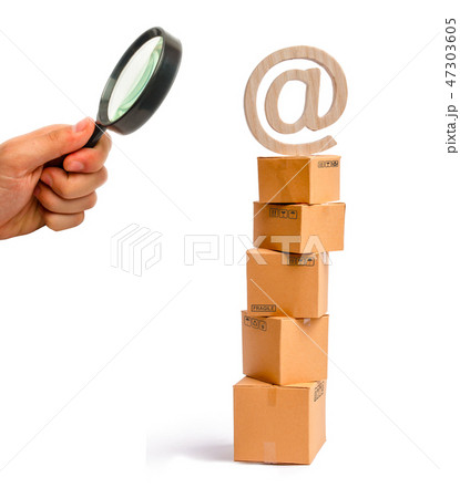 Magnifying glass looking at the tower of boxes 47303605