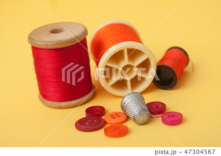 closeup of sewing set on yellow background closeup of sewing set on yellow background 47304567