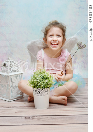 Laughing cute witch with wand Laughing cute witch with wand 47305488