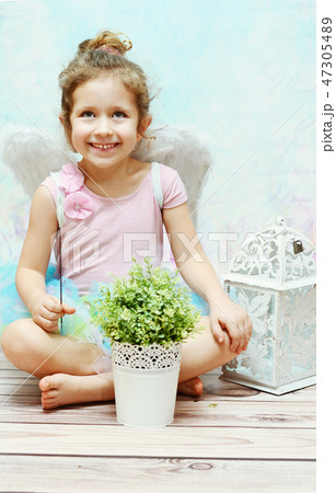 Little smiling witch with fancy wings Little smiling witch with fancy wings 47305489