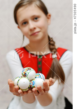 Young girl wearing local traditional costume Young girl wearing local traditional costume 47305490