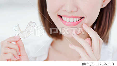 woman with retainer for teeth woman with retainer for teeth 47307113