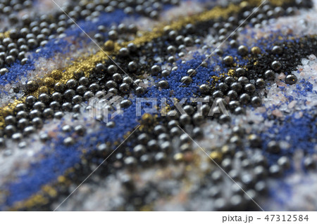 Layered blur sand pattern. Marble style background. Blue and gold powder defocused texture. Layered blur sand pattern. Marble style background. Blue and gold powder defocused texture. 47312584